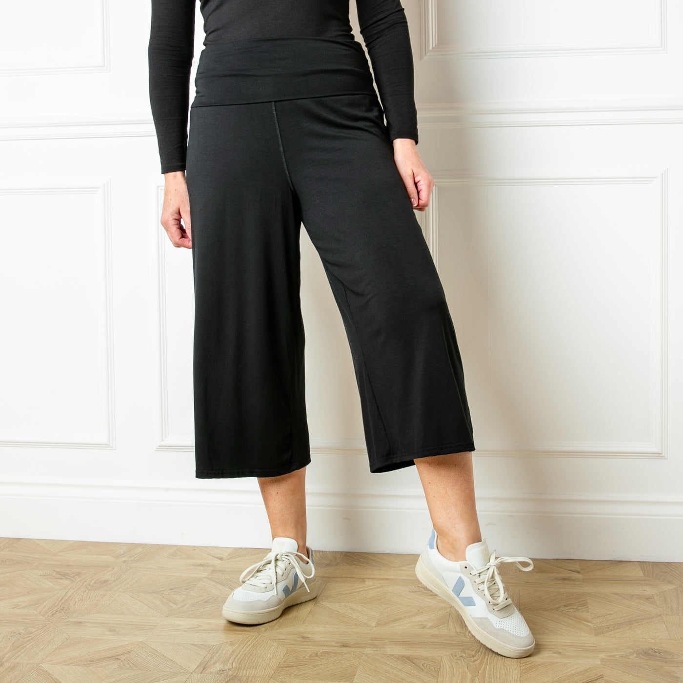 The black Bamboo Fold Over Pants with a wide leg silhouette in a soft and stretchy material
