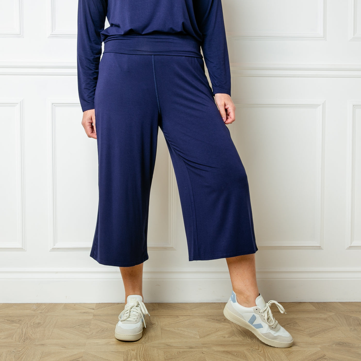 The navy blue Bamboo Fold Over Pants with a wide leg silhouette in a soft and stretchy material