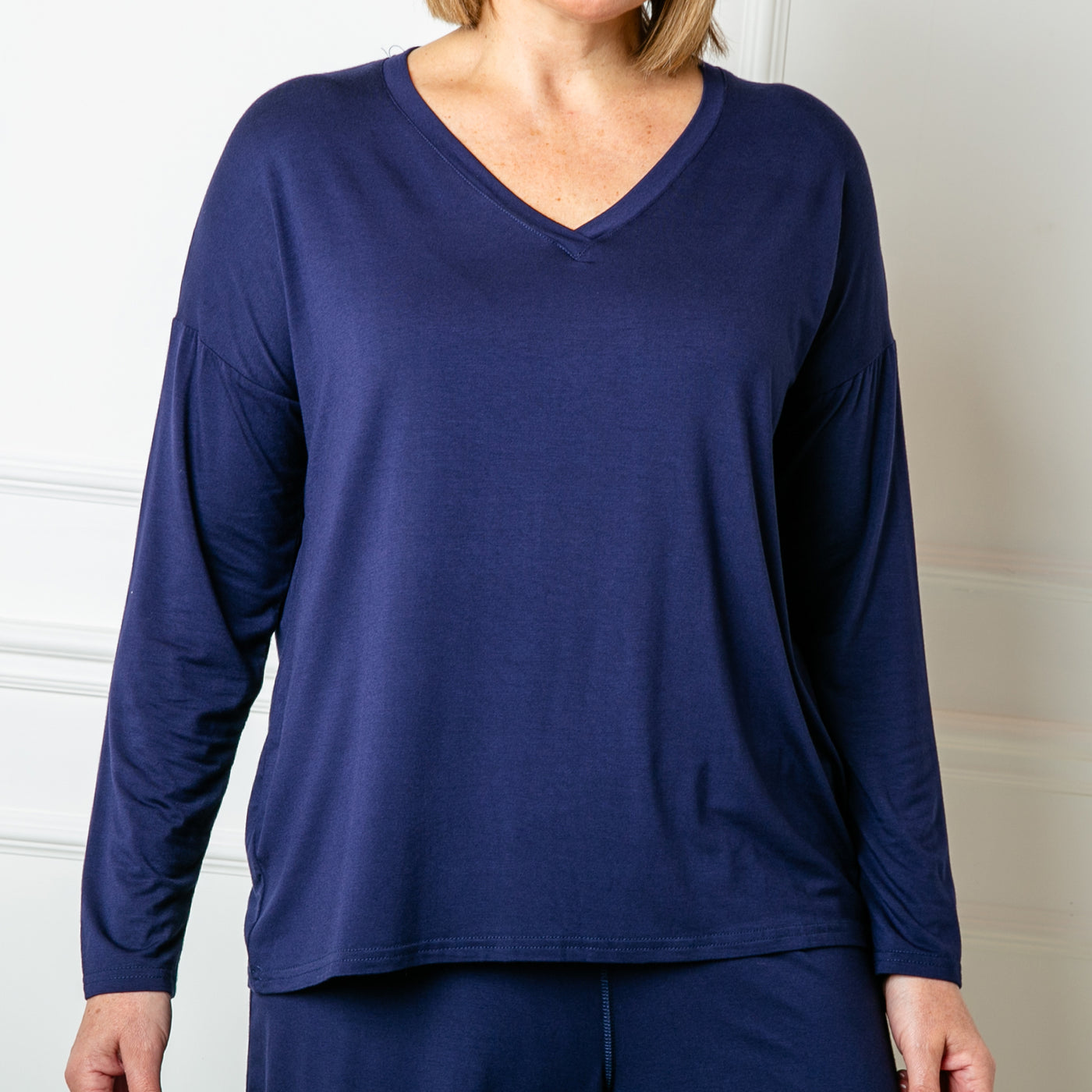 The navy blue Bamboo Long Sleeve Top with a v neckline for a flattering fit