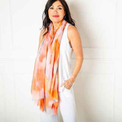 The orange Barcelona scarf which is made from a blend of viscose and cotton, perfect for summer