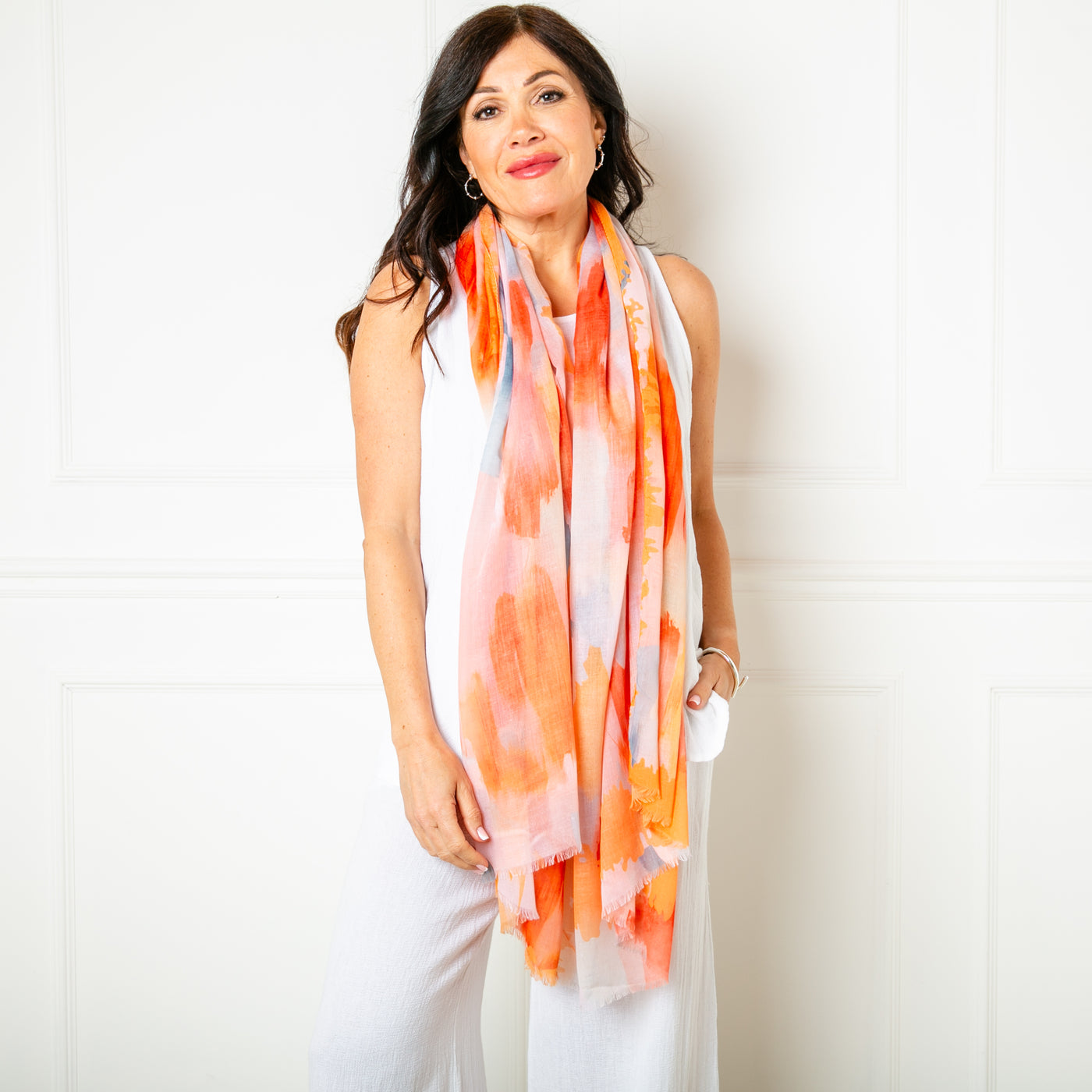 The orange Barcelona scarf which can be worn in so many different ways and is perfect for your next holiday