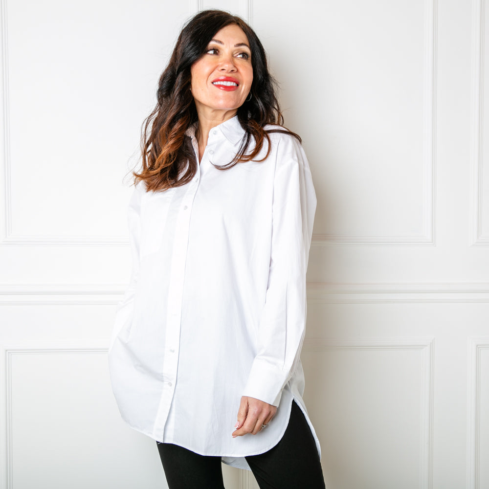The Basics White Shirt featuring a pocket on the front on one side and a high low hem at the front and back