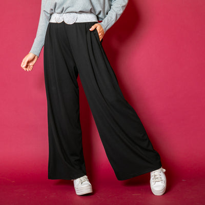 The Basics Wide Leg Trousers in black with pockets on either side of the hip