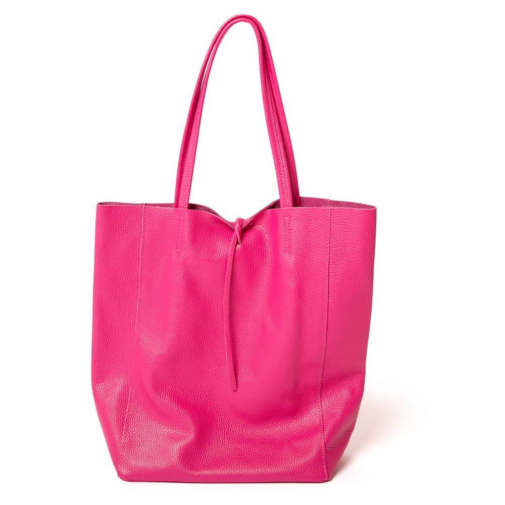 The fuchsia pink Berlin Leather Tote Bag with a tie detail at the opening for fastening