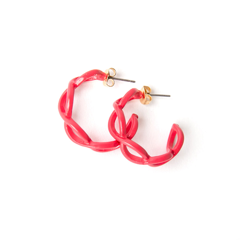 The Billie Earrings in fuchsia pink red with a twisted intertwined hoop design 