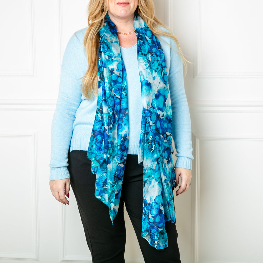 The Blue Ink Dot Silk Scarf made from 100% luxurious silk