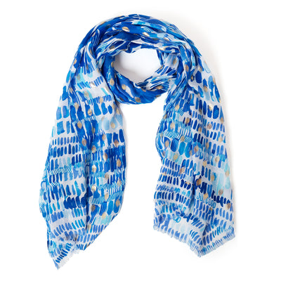 The Bora Scarf in blue which can be worn in many ways including as a sarong on the beach