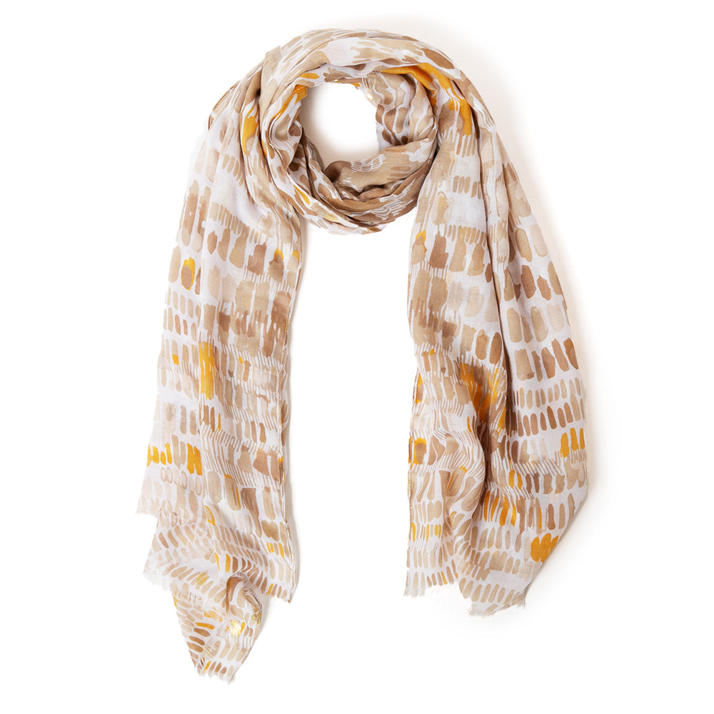 The Bora Scarf in taupe brown which can be worn in many ways including as a sarong on the beach