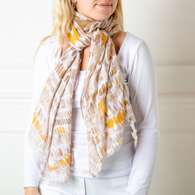The taupe brown Bora Scarf made from 100% viscose, super soft and lightweight, perfect for spring and summer