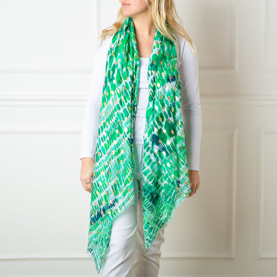 The green Bora Scarf made from 100% viscose, super soft and lightweight, perfect for spring and summer