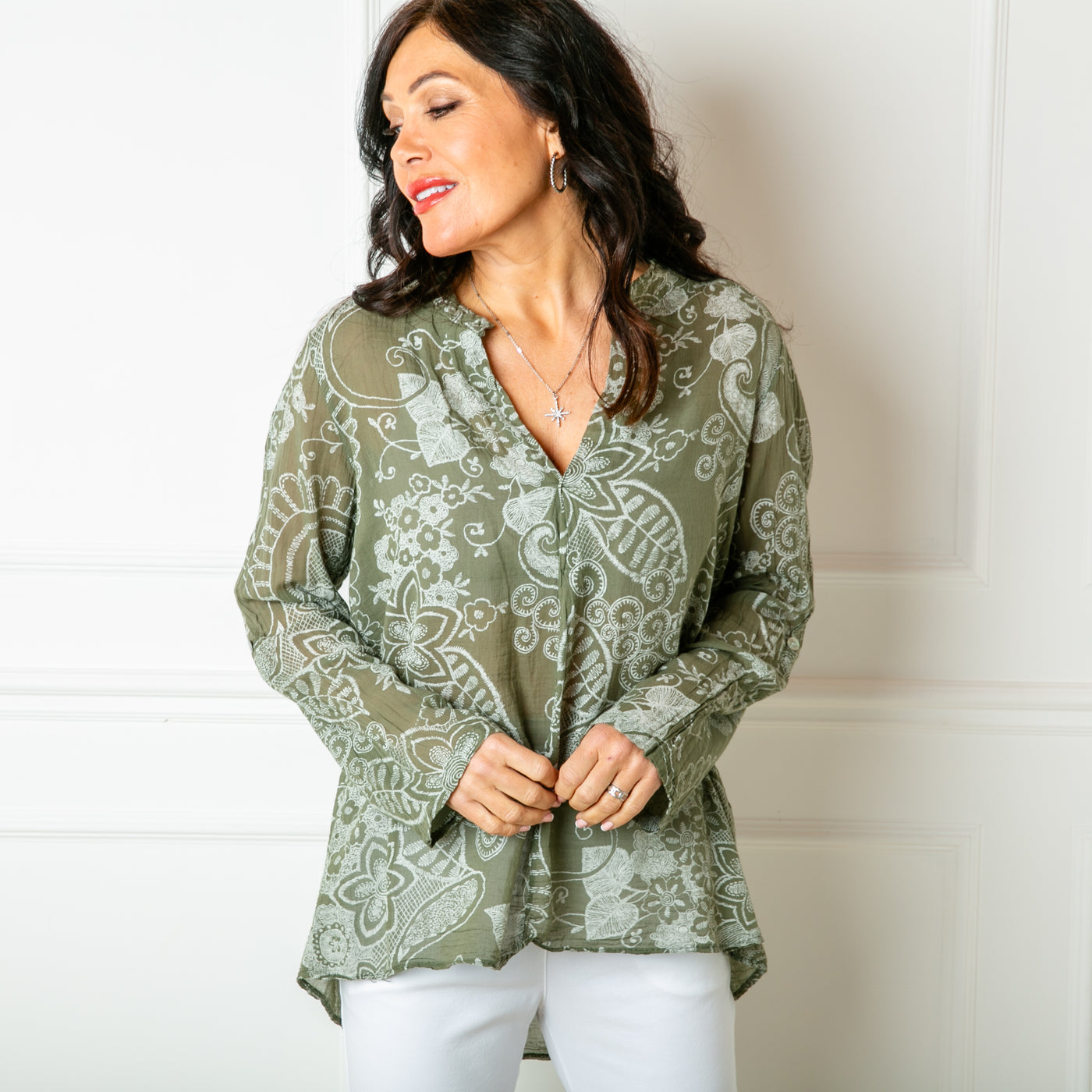 The khaki green Botanical Cotton Blouse with long sleeves that can be rolled up and buttoned at the elbow