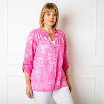The pink Botanical Cotton Blouse in a beautiful floral paisley print with white accents