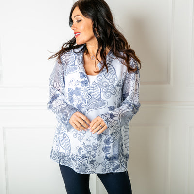 The white Botanical Cotton Blouse with long sleeves that can be rolled up and buttoned at the elbow