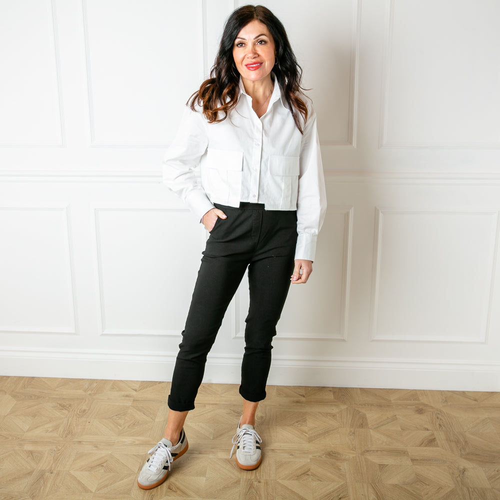 The Boxy Cropped Shirt in white with large utility style cargo pockets on either side of the front for a fun edgy look