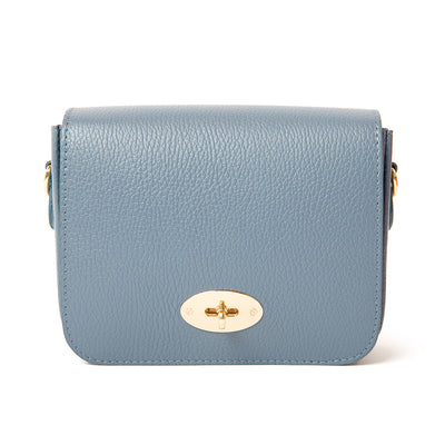 The denim blue Buckingham Leather Handbag which features a twist clasp fastening in gold metal hardware