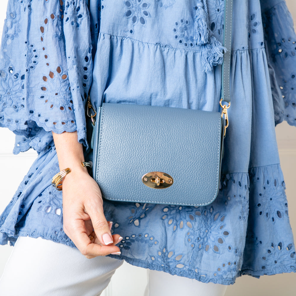 The denim blue Buckingham Leather Handbag which comes with a matching detachable strap to wear across the body