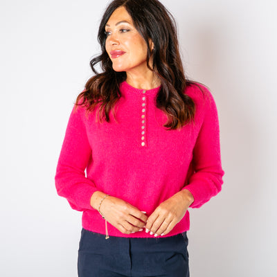 The hot pink Button Crew Alpaca Jumper with long sleeves and a round crew neckline