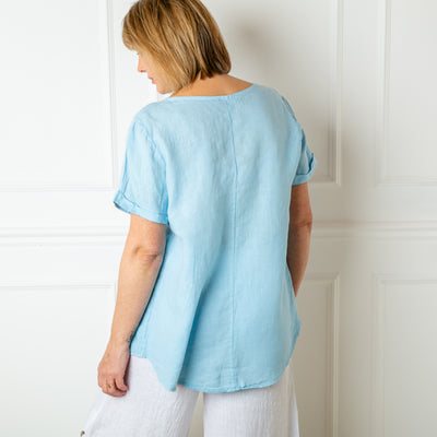 The blue Button Down Linen Top made from 100% linen, perfect for a lightweight, cool summer look