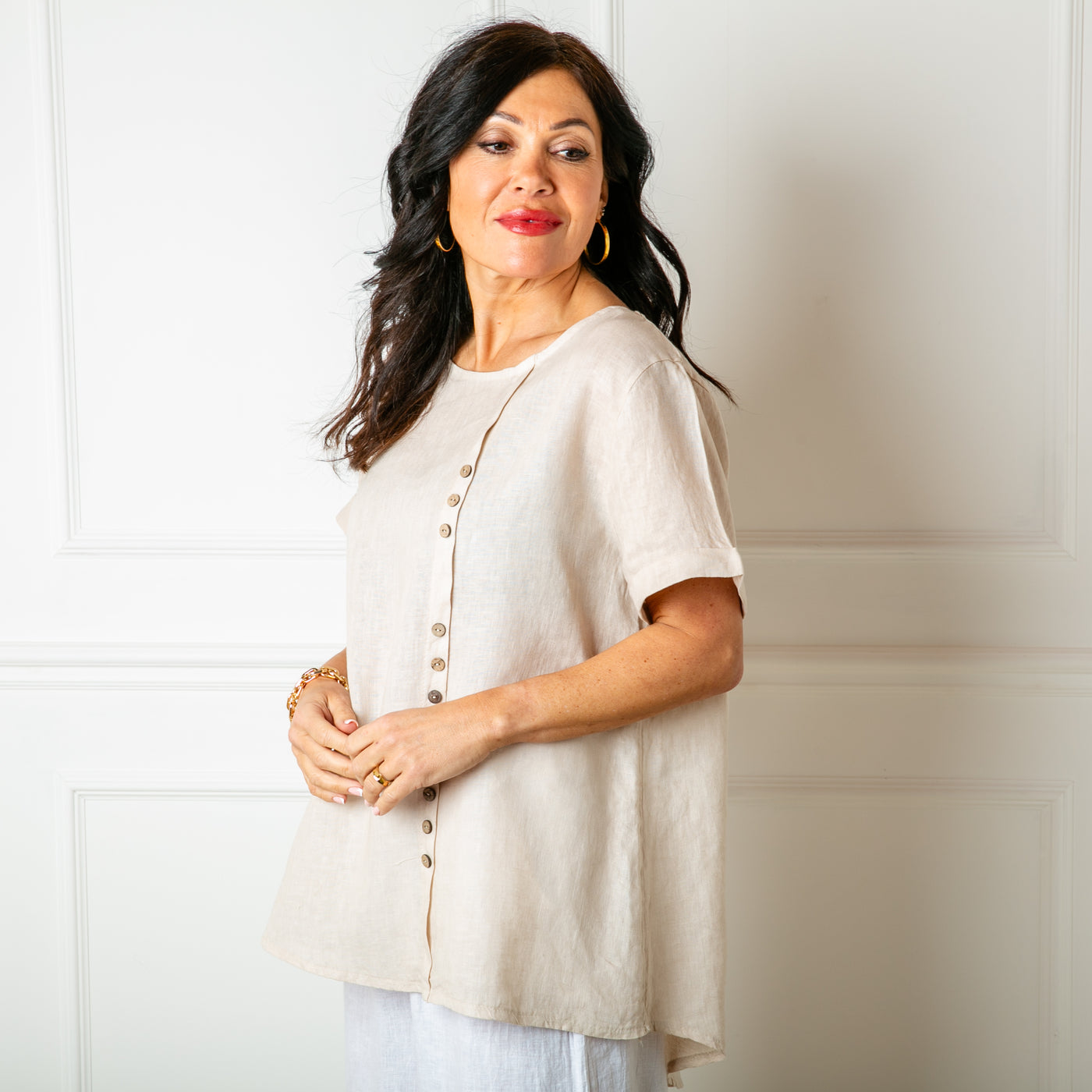 The natural stone cream Button Down Linen Top made from 100% linen, perfect for a lightweight, cool summer look