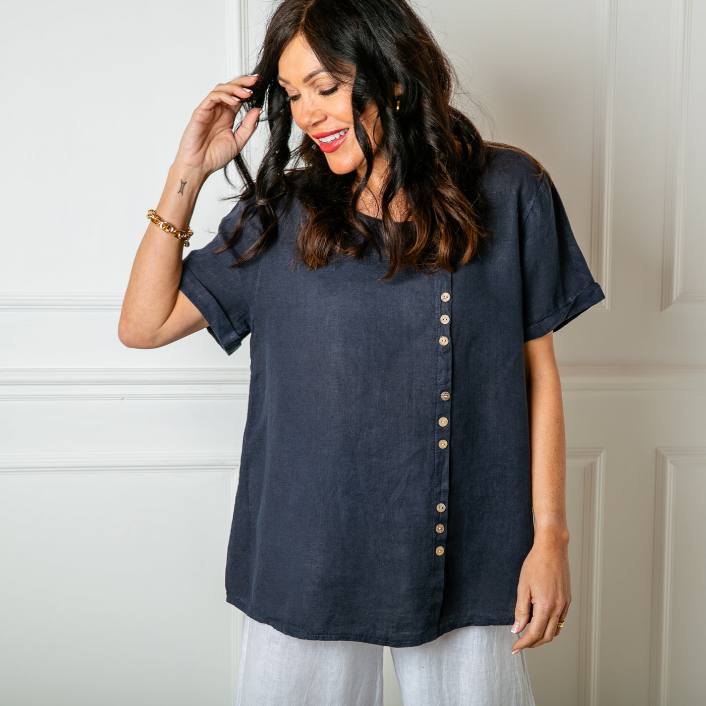 The navy blue Button Down Linen Top with short sleeves and a round neckline