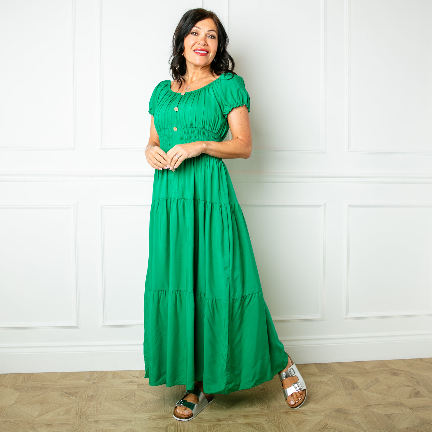 The Button Front Maxi Dress in emerald green with button detailing down the front and a shirred elasticated stretchy waistband 
