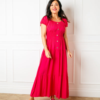 The fuchsia pink Button Front Maxi Dress with short puffy sleeves that can be worn on or off the shoulder