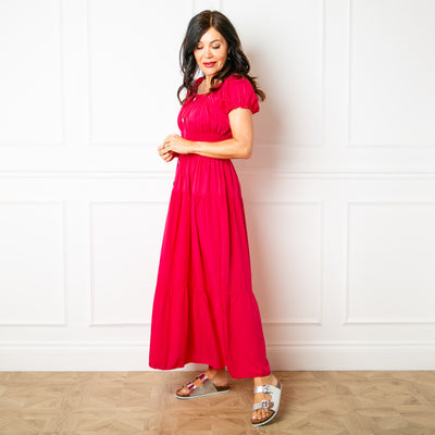 The Button Front Maxi Dress in fuchsia pink with button detailing down the front and a shirred elasticated stretchy waistband 