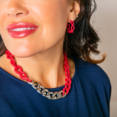 The fuchsia pink red Camilo Necklace with a chunky chain, perfect for adding a pop of colour to any outfit. Statement jewellery.