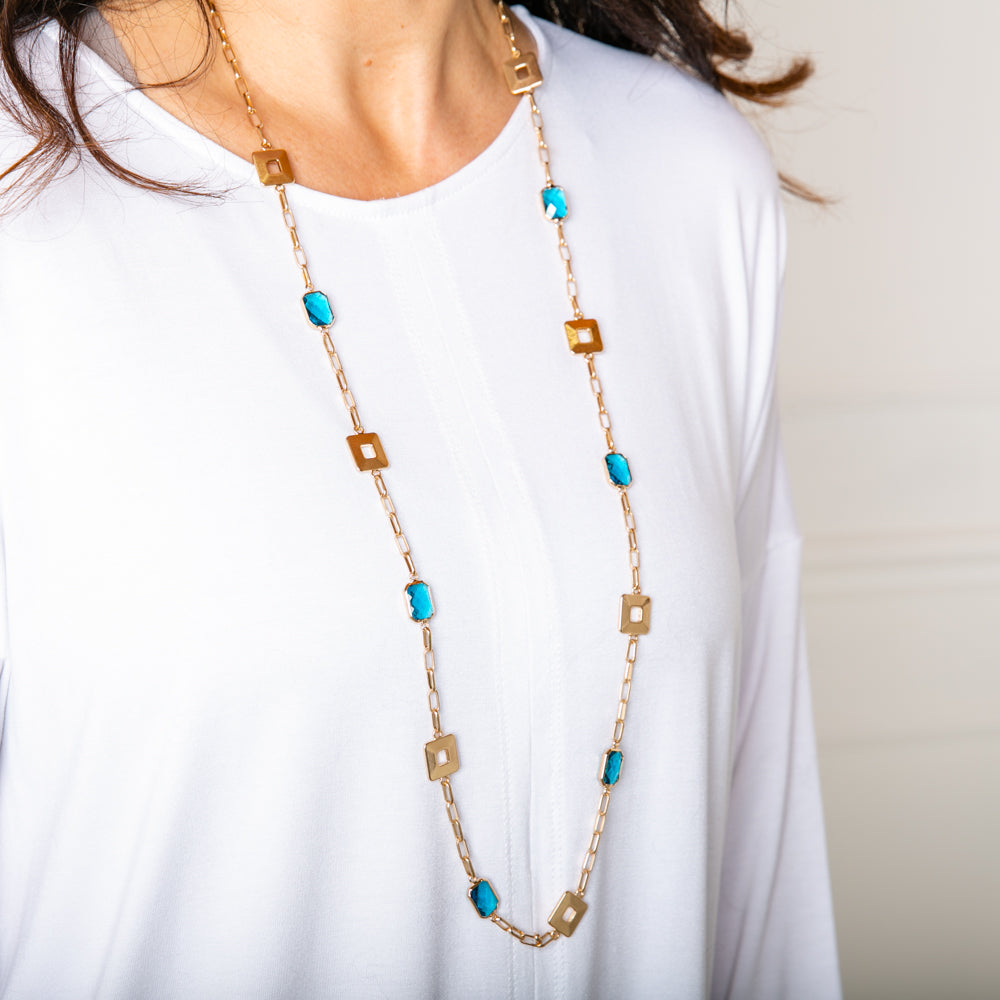 Casey Necklace in gold and turquoise with a fine wide hoop chain and an extender to adjust to desired length
