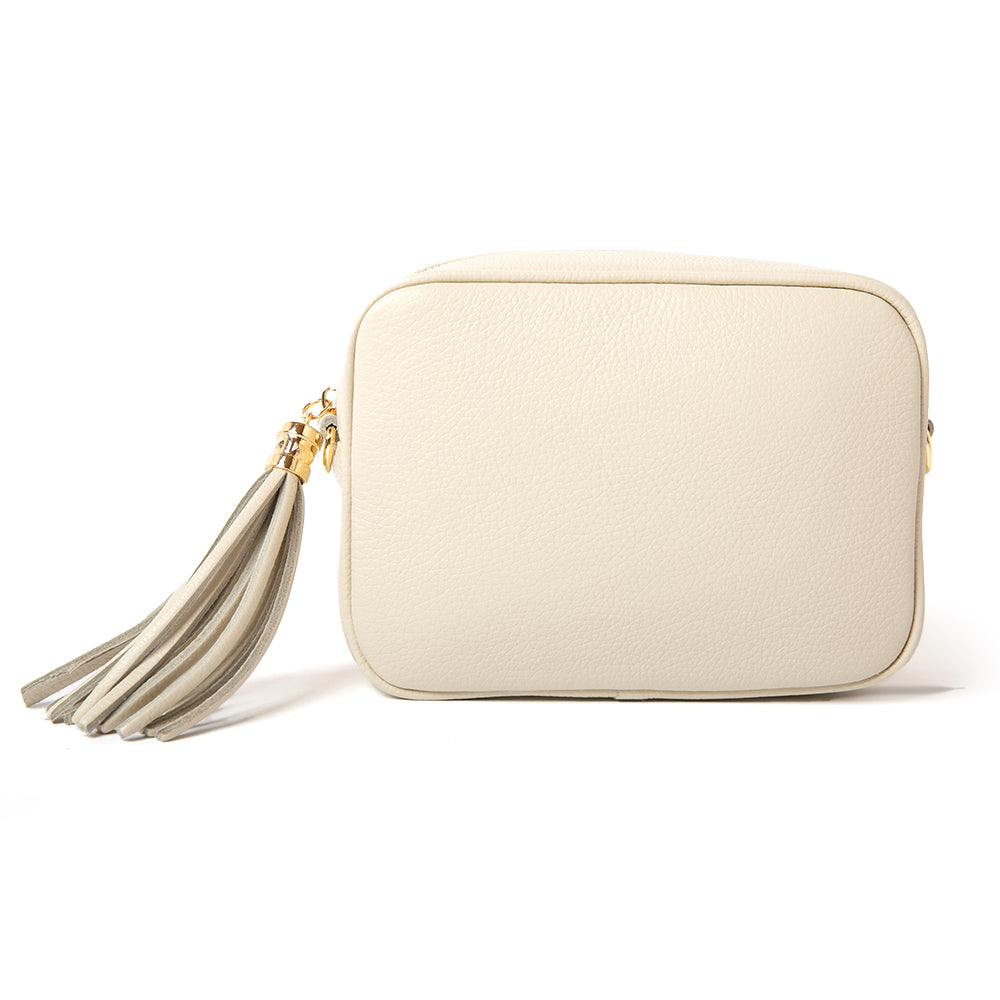 The cream Chichester handbag made from luxurious italian leather with a matching detachable strap and a tassle detail on the zip