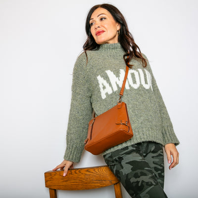 The khaki green Chunky Slogan Jumper with long sleeves and a high neckline