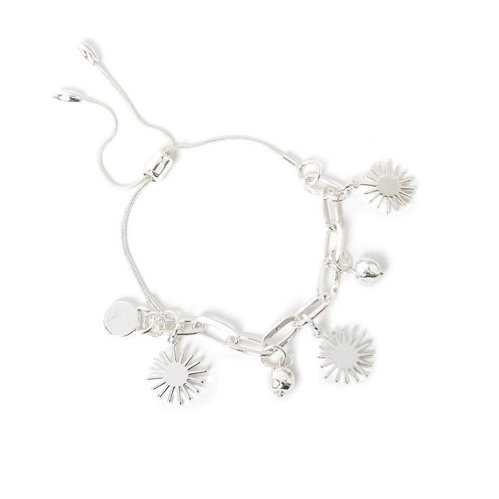 The silver Coco Bracelet featuring gorgeous sun charms on a wide link chain