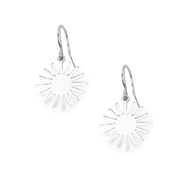 The Coco Earrings in silver in a sunshine shape with a hook fastening through the ear