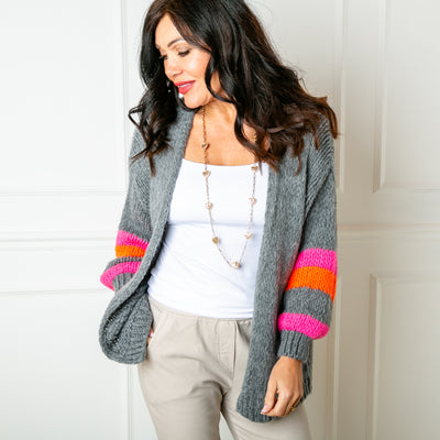 The Contrast Stripe Cardigan in charcoal grey with long balloon shaped sleeves and an open front