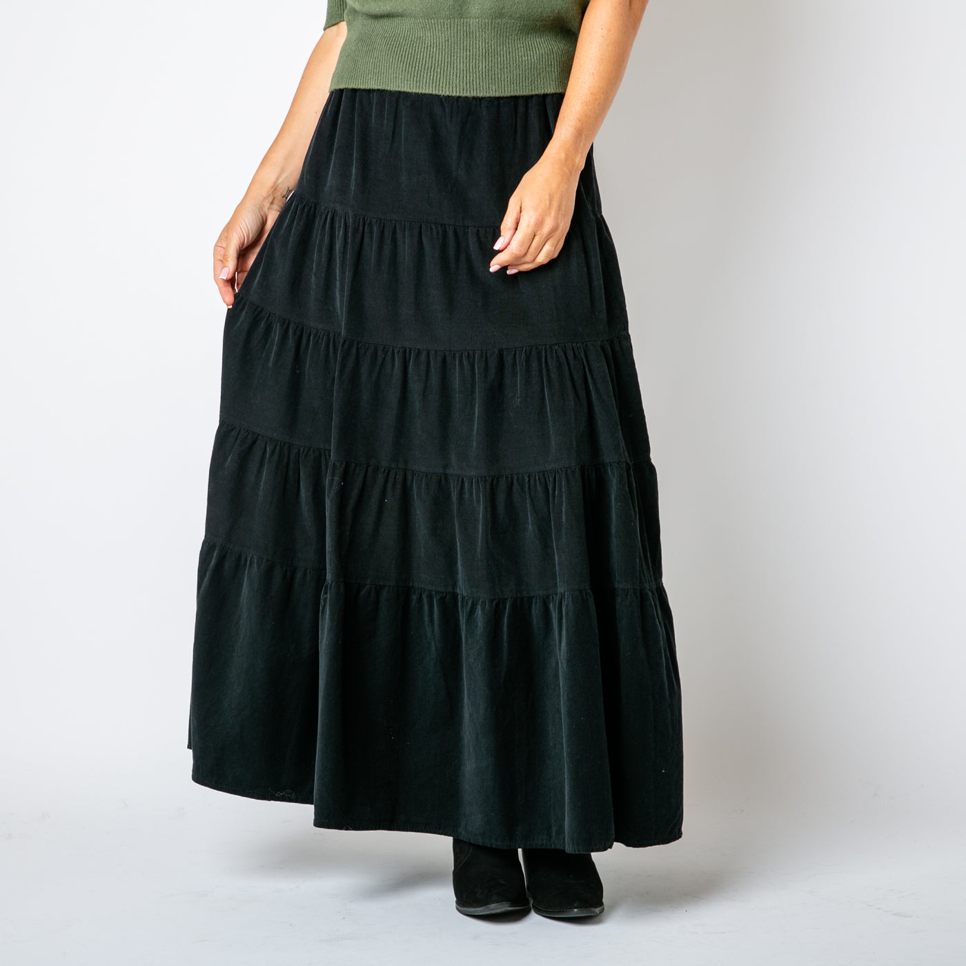 The Cord Tiered Skirt in black with a stretchy elasticated waistband