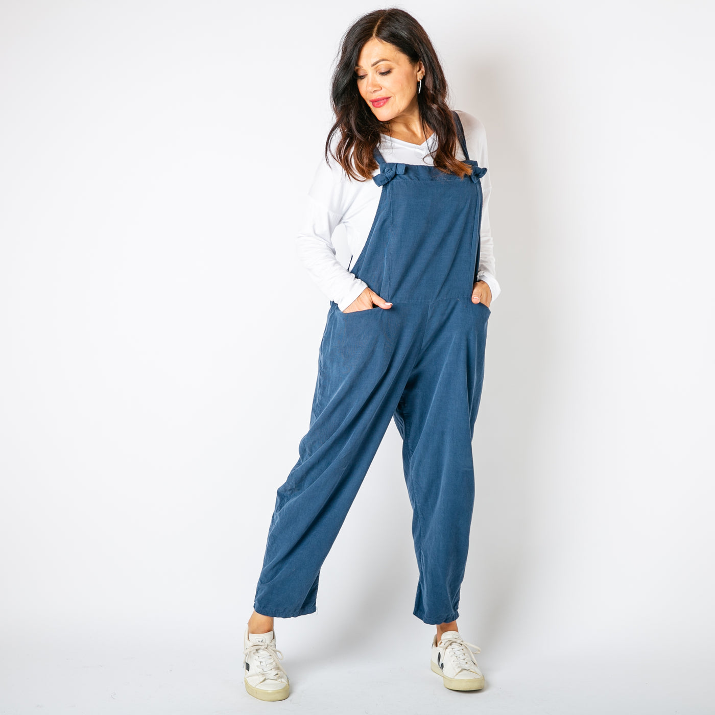 The denim blue Corduroy Dungarees with tie up straps that can be adjusted to desired length