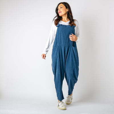 The denim blue Corduroy Dungarees with large pockets on either side of the hip