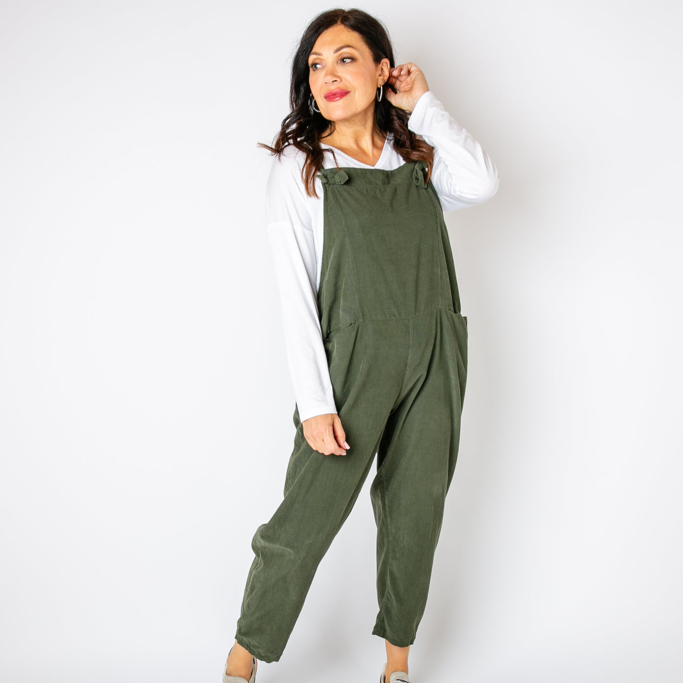 The khaki green Corduroy Dungarees with large pockets on either side of the hip