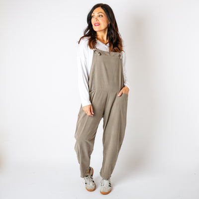 The stone brown cream Corduroy Dungarees with large pockets on either side of the hip