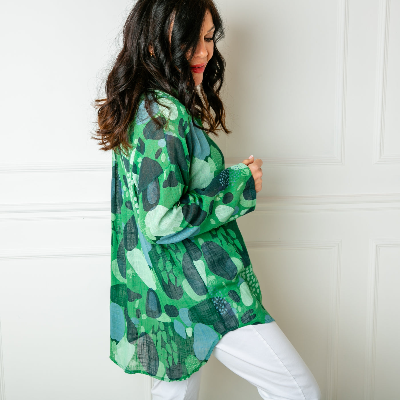 The Cotton Spot Print Shirt in green with a traditional shirt collar and buttons down the front