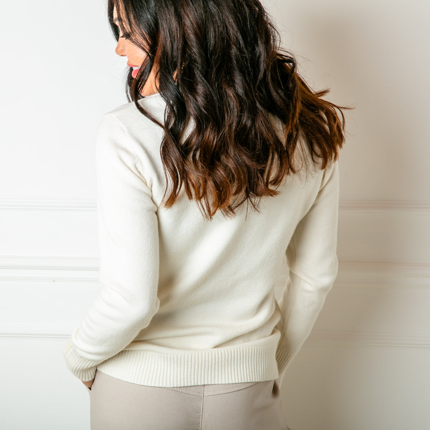 The cream Crew Neck Button Jumper with ribbed detailing on the cuffs, neckline and bottom hemline