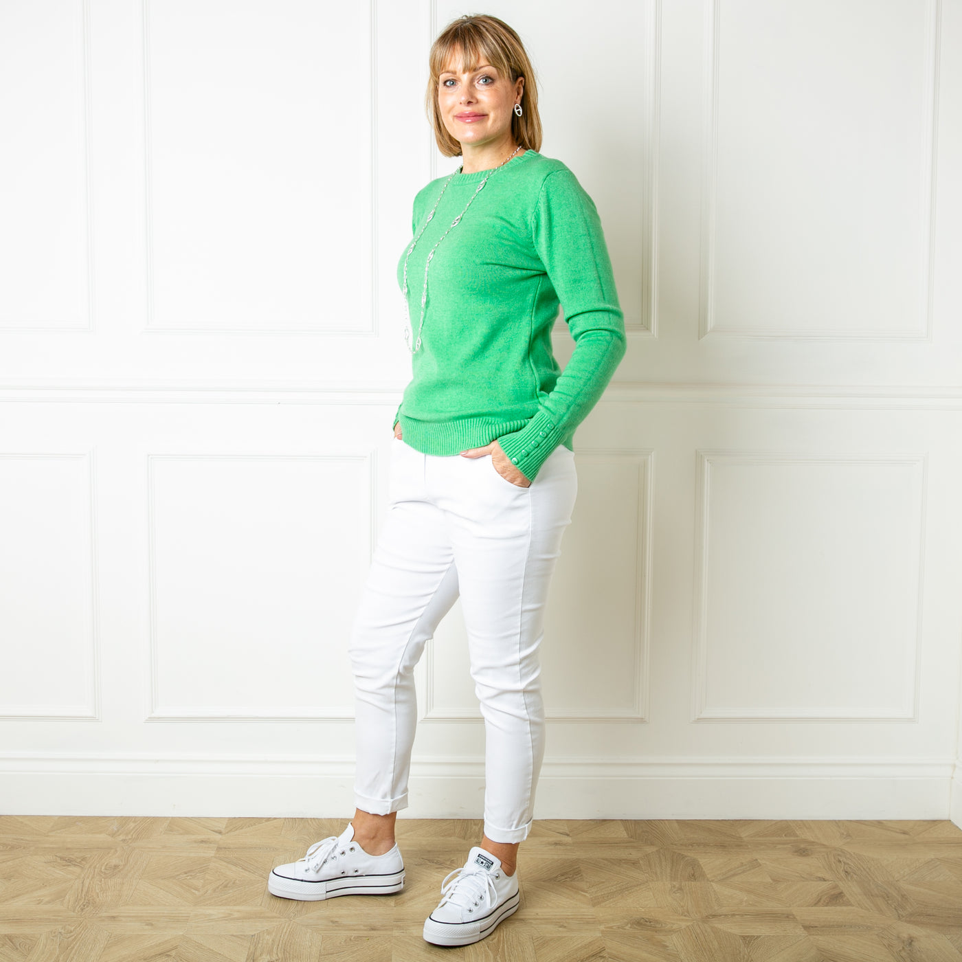 The emerald green Crew Neck Button Jumper with ribbed detailing on the cuffs, neckline and bottom hemline
