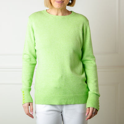 The green Crew Neck Button Jumper with ribbed detailing on the cuffs, neckline and bottom hemline