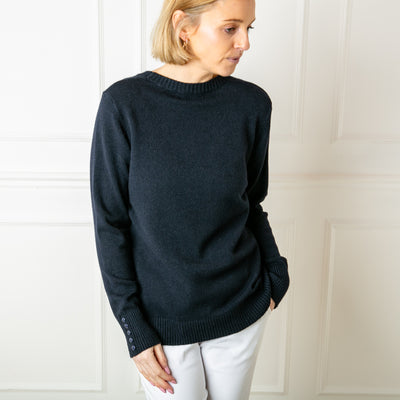 The navy blue Crew Neck Button Jumper with ribbed detailing on the cuffs, neckline and bottom hemline