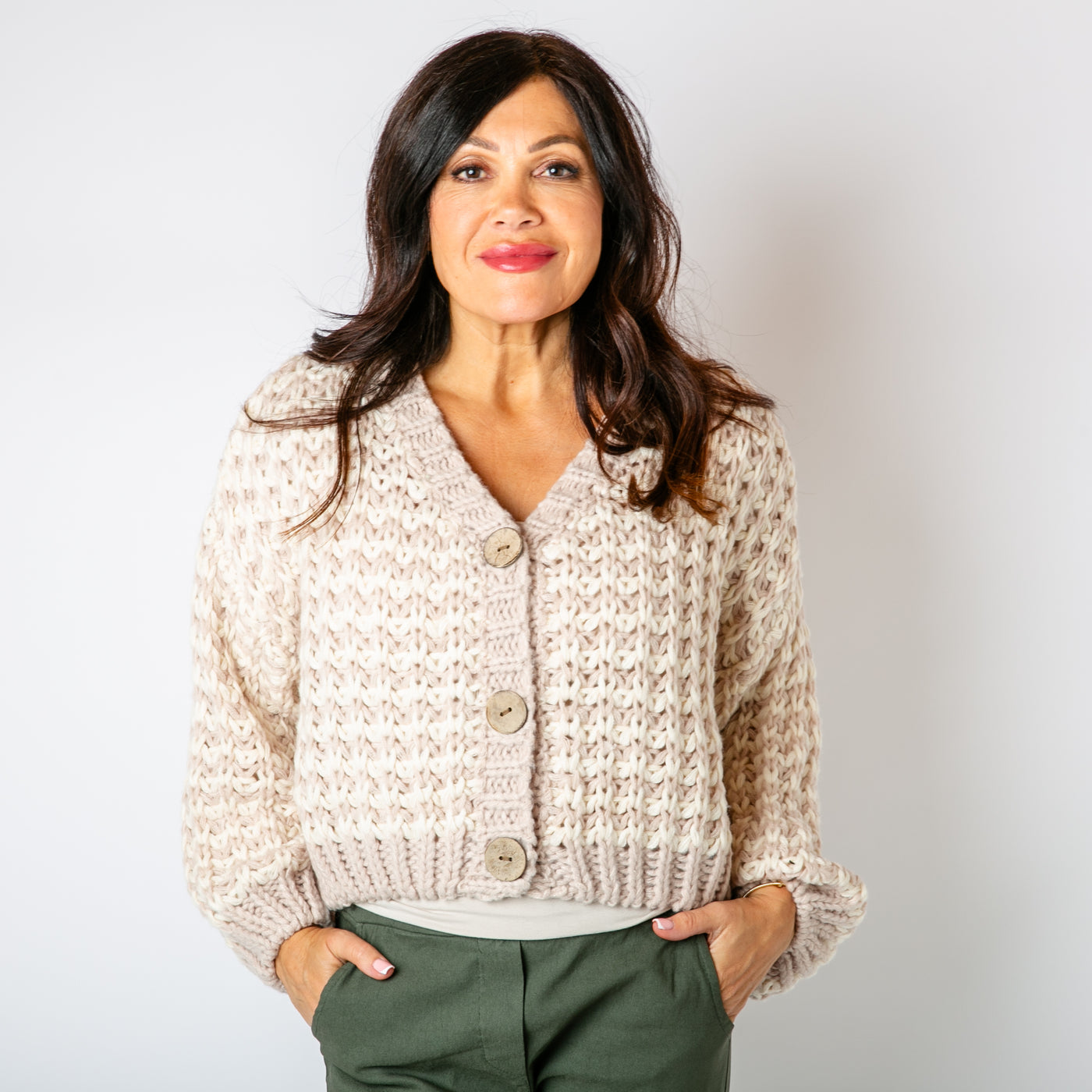 The stone cream Cropped Chunky Knit Cardigan with large wooden buttons down the front for fastening