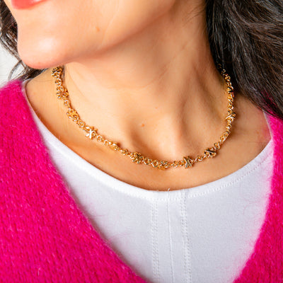The Cross Necklace in gold with an adjustable extender to suit desired length