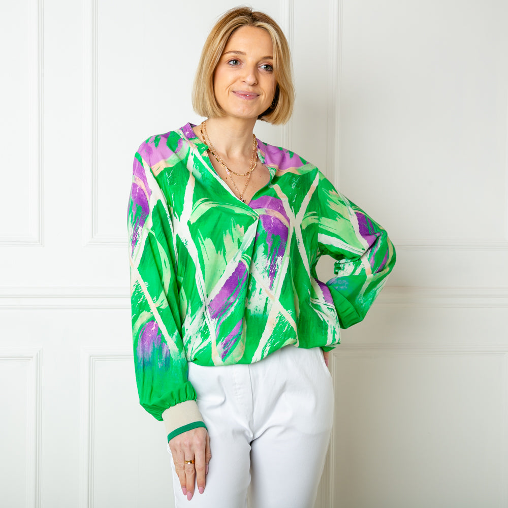The green Crossing Pattern Jersey Cuff Top with long billowing sleeves and a stretchy elasticated cuff on the end