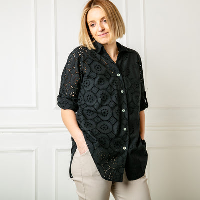 The black Cut Out Blouse with a shirt collar and button fastening down the front