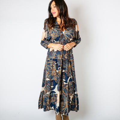 The navy blue Dahlia Print Tiered Dress with 3/4 length sleeves that have a stretchy elasticated cuff