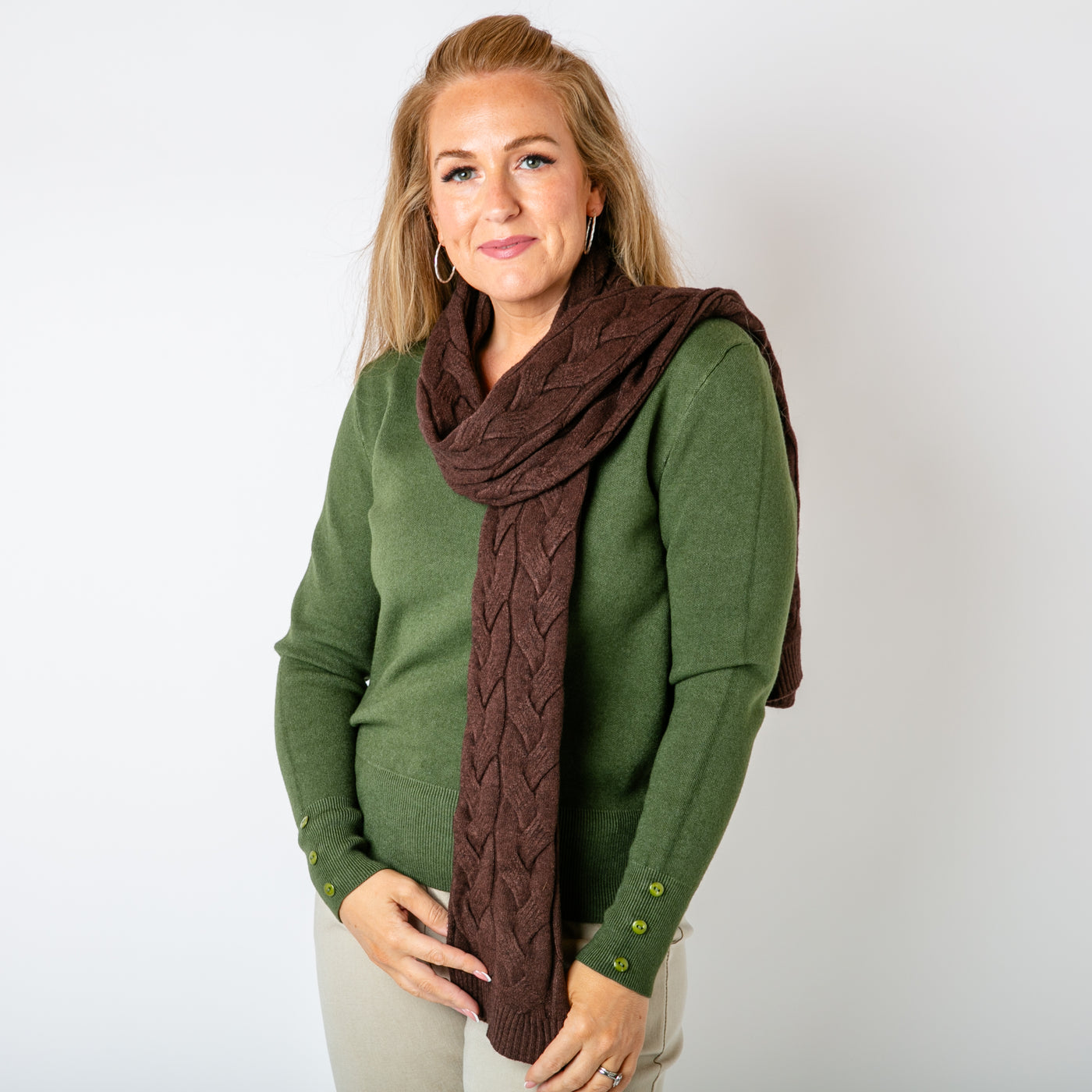 The chocolate brown Daphne Cable Knit Scarf made from a blend of viscose and nylon